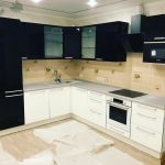 white kitchen set with black and beige