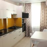 white kitchen set with curtains