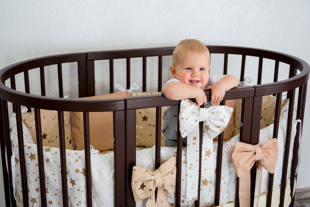 baby in a pendulum crib