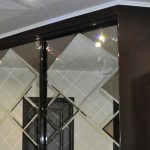 sliding wardrobe with faceted mirror decor photo