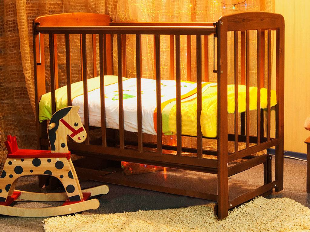 rock a baby in a pendulum crib
