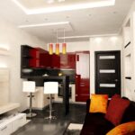 cuisine 12 m avec un canapé rouge