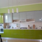 green kitchen with tidy cabinets