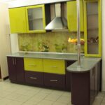 green kitchen with dark brown