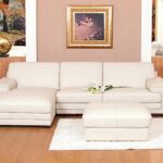 canapé en cuir blanc avec pouf