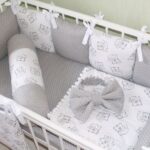 parachoques de cama grises con lazo