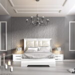 spaziosa camera da letto con mobili bianchi