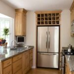 small kitchen with large refrigerator