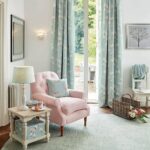 mint curtains with pink armchair