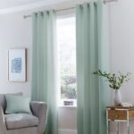mint curtains with vase