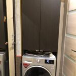 Kleiderschrank über der Waschmaschine Arten von Fotos