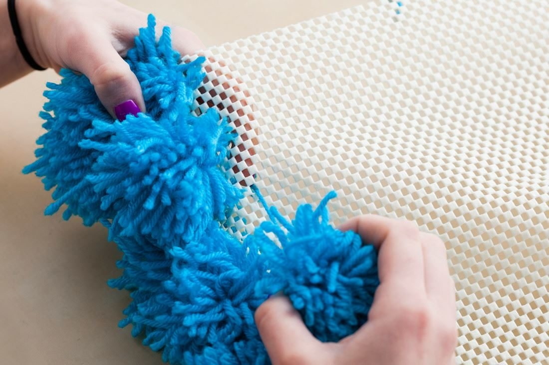 photo de conception de tapis à pompons