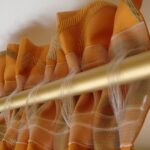 formas de unir cortinas a la decoración fotográfica de la cornisa